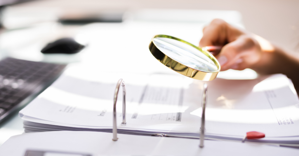 Magnifying Glass over Financial Documents